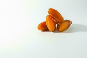 Fresh ripe yellow dates, fresh dates ruthob isolated on white background photo