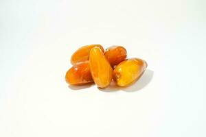 Fresh ripe yellow dates, fresh dates ruthob isolated on white background photo