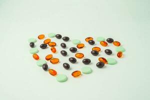 Many different tablet pills on white background, flat lay, with copy space. photo