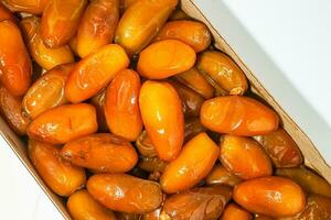 Fresh ripe yellow dates, fresh dates ruthob isolated on white background photo