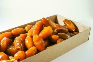 Fresh ripe yellow dates, fresh dates ruthob isolated on white background photo