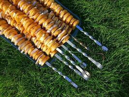 pickled potatoes and lard on skewers photo