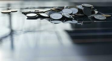 Silver coins on the solar panel help store solar energy. photo