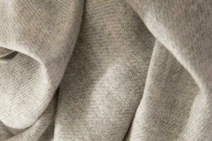 Natural wool grey fabric. Cashmere, wool. Texture of natural wool fabric. Knitwear. photo