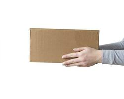 Delivery cardboard boxes in woman hand isolated photo