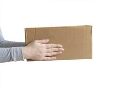 Delivery cardboard boxes in woman hand isolated photo