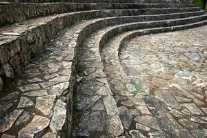 Curved stone steps for sit and rest on the mountain in national park at Thailand photo