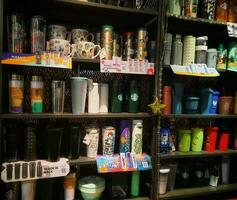 Jakarta, Indonesia in January 2022. Various types of Starbucks tumblers or drinking bottles are being sold and displayed in the shop windows. photo