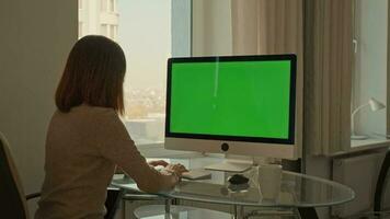 freelancer typing on keyboard at workspace video