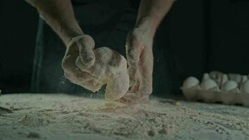 male hands kneading dough video