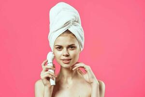 woman with towel on head naked shoulders massage medicine cosmetics photo