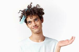 curly guy with comb in hair emotions fun cropped view photo