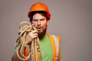 Worker man in orange paint construction security professional photo