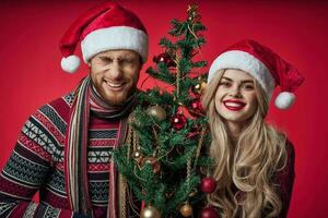 merry married couple celebrate christmas new year red background photo