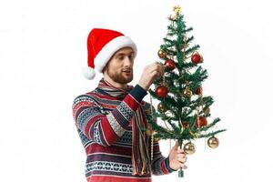 handsome man in New Year's clothes decoration christmas studio posing photo