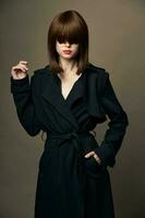 Charming brunette European appearance suit outerwear side view photo