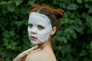 Nice girl white mask Holds hand near neck side view skin care photo