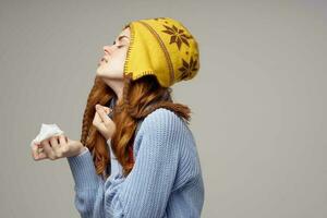 sick woman neck scarf with a hat on his head isolated background photo