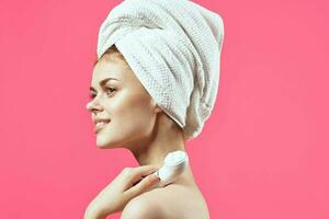 woman with towel on head cleaning skin therapy close-up photo