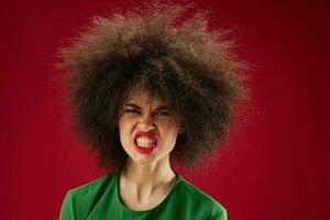 Beautiful fashionable girl grimace afro hairstyle red lips fashion color background unaltered photo