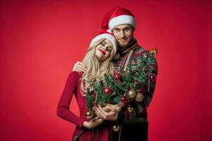 man and woman celebrate christmas happiness romance red background photo