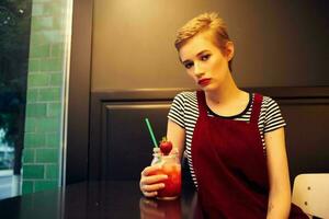 woman with short hair sitting in cafe cocktail vacation lifestyle photo