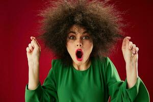 Portrait of a charming lady Afro hairstyle green dress emotions close-up color background unaltered photo