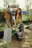 Woman feeds chickens organic food for bird health and good eggs and care for the environment photo