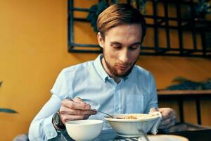 restaurant man soup and various dishes snack at work lunch break photo