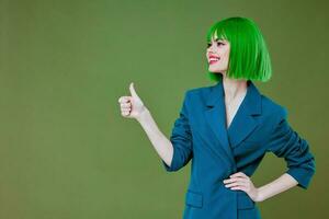 Beauty Fashion woman attractive look green wig blue jacket posing color background unaltered photo