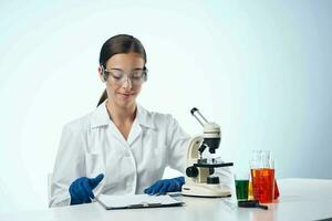 Cheerful woman laboratory assistant science microscope biotechnology photo