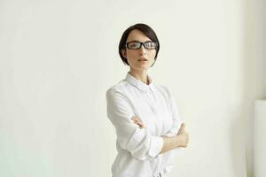 Businesswoman with glasses self-confidence light background photo