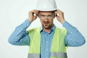 man reflective vest blueprints builder isolated background photo