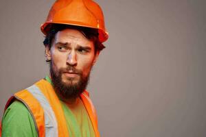 Man in working uniform orange paint safety work cropped view photo