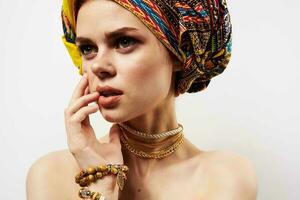 woman in multicolored turban decoration cosmetics makeup fun photo