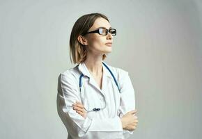 portrait of female doctor in medical gown and blue stethoscope cropped view photo