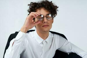 guy curly hair glasses and jacket photography studio model light background Copy Space photo