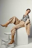 brunette in trendy clothes shirt leopard brown fashion boots photo