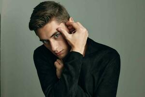 Cute young guy hairstyle black shirt glamor close-up photo