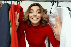 cheerful woman in a red jacket near the wardrobe emotions photo