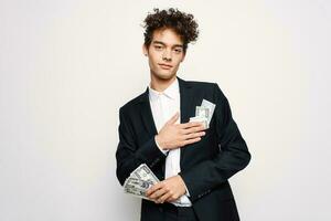 man in a suit a bundle of money in the hands of a businessman self-confidence photo