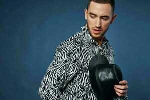 man in shirt wearing black hat posing fashion elegant style photo