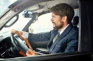 emotional man in a suit in a car a trip to work rich photo