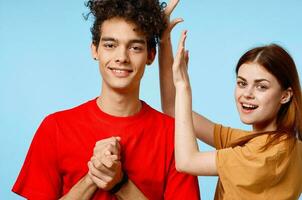 a guy and a girl in colorful t-shirts more fun studio modern style photo