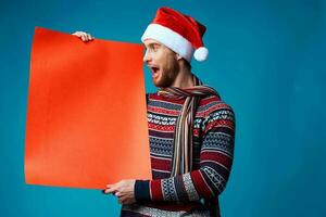 Cheerful man in a christmas Orange mockup Poster studio posing photo