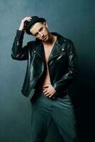 handsome man wearing hat leather jacket fashion modern posing style photo