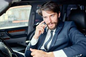 businessmen Driving a car trip luxury lifestyle self confidence photo