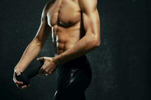 man athlete inflated body workout gym dark background photo