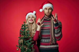 cheerful married couple in new year clothes decorating lifestyle photo