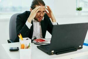 businessman phone laptop work emotions technologies photo